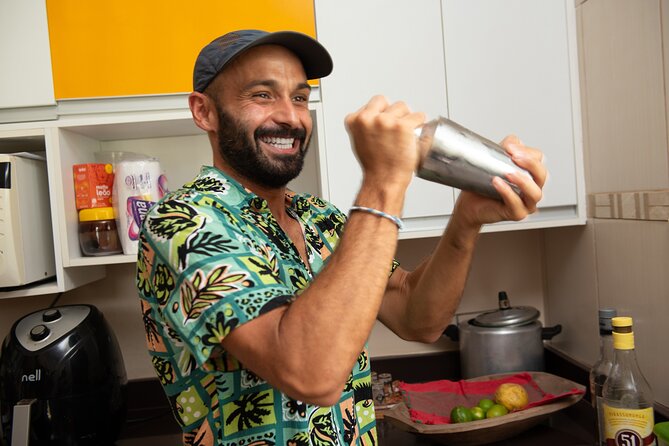 4h Cooking Class in Salvador with 9 Recipes & Bottomless Drinks - A table set with caipirinhas and conversation