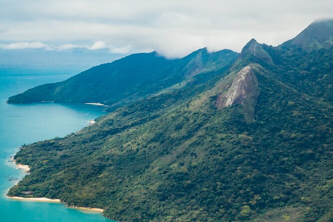 Adventure experience at Peak Sugar Bread by PARATY TOURS - Starting the 466-Meter Climb at Praia do Cruzeiro