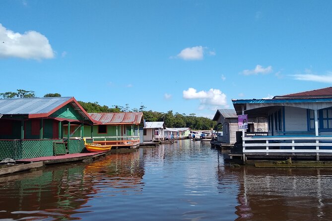 Amazon River Safari Boat Tour- Full Day Group Tour - Pirarucu, fish farming, and souvenir stops
