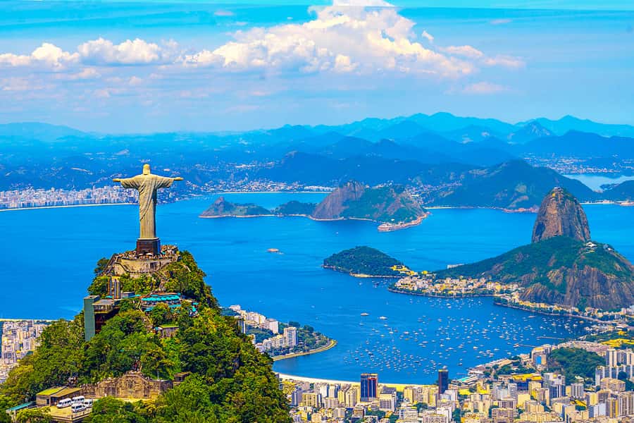 Christ the Redeemer above Guanabara Bay and Sugarloaf