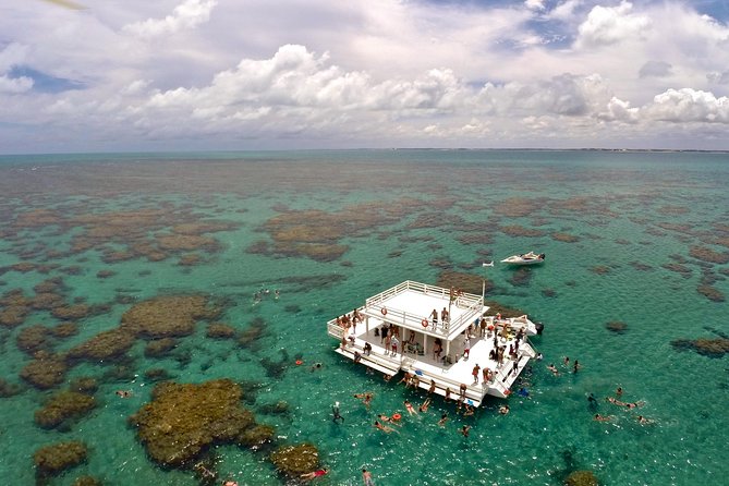 Discover Underwater Beauty: Explore Maracajaú's Parrachos Reef - Reaching the Parrachos Reef by boat