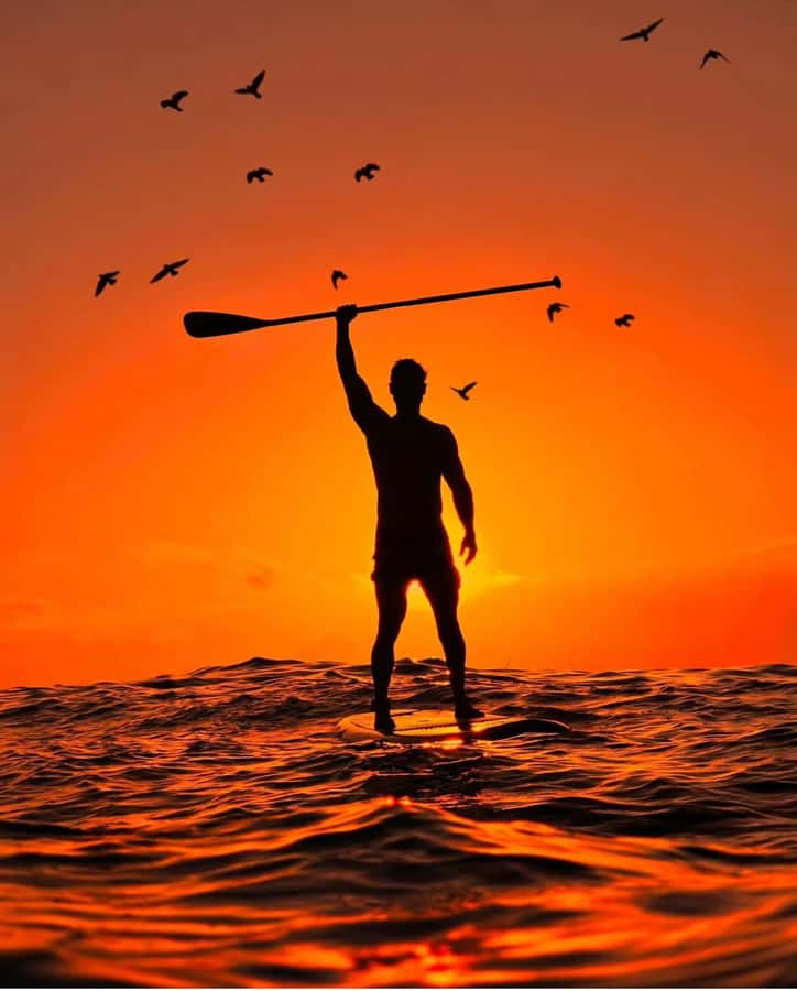 Rio de Janeiro: Copacabana Sunrise Stand Up Paddleboard Tour - Starting the class with board, paddle, leash, and safety gear